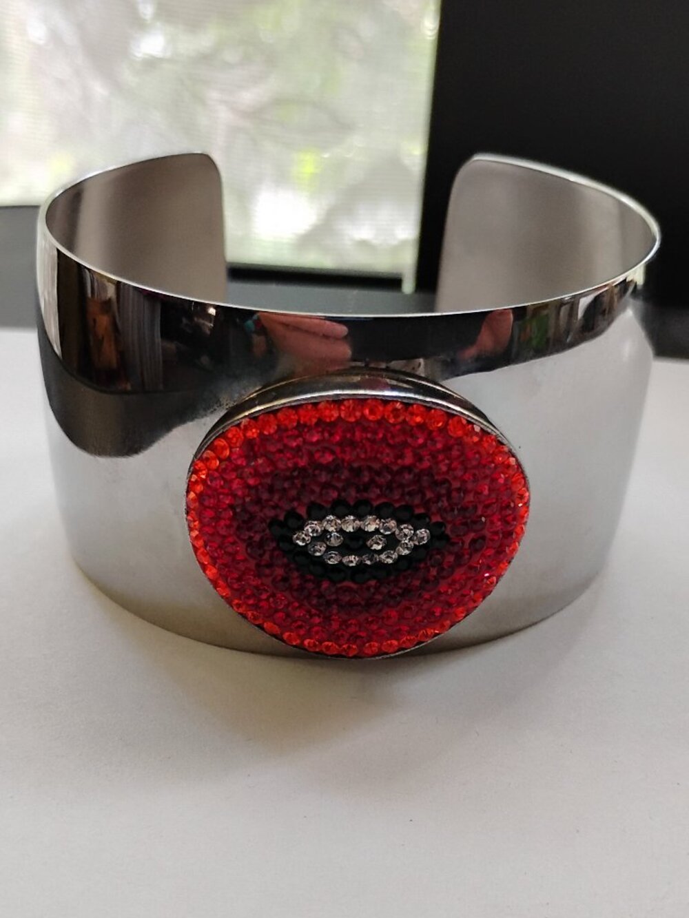 Shiny Silvertone Cuff Bangle with Red Beaded Eye